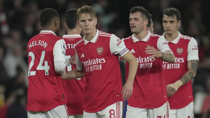 Arsenals Martin Odegaard, centre, celebrates after the English Premier League soccer match between Arsenal and Chelsea at the Emirates Stadium in London, Tuesday, May 2, 2023. (AP Photo/Kin Cheung)
