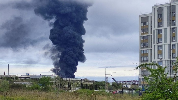 Smoke rises over a fuel tank following an alleged drone attack in Sevastopol, Crimea, April 29, 2023. REUTERS/Stringer