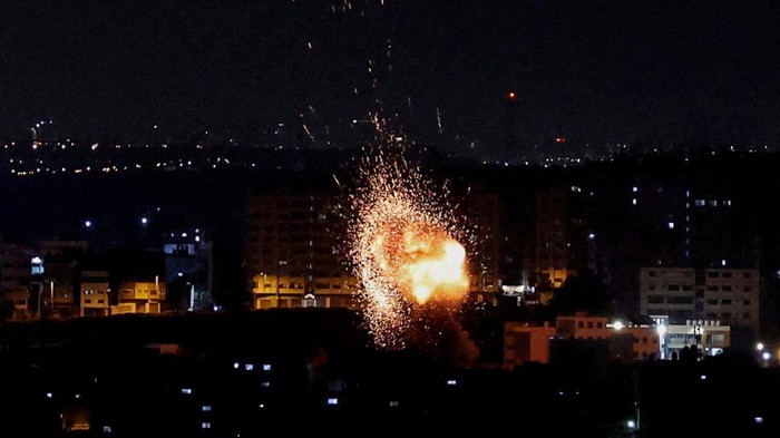 An explosion and smoke rising are seen as Israel strikes Gaza May 2, 2023. REUTERS/Mohammed Salem