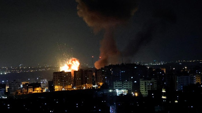 An explosion and smoke rising are seen as Israel strikes Gaza May 2, 2023. REUTERS/Mohammed Salem