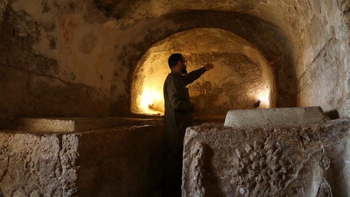 People stand outside the Cave of the Seven Sleepers, in Amman, Jordan April 14, 2023. REUTERS/Alaa Al Sukhni