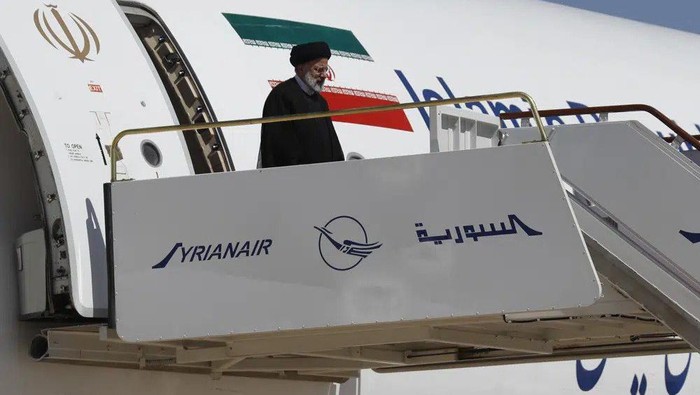 Iranian President Ebrahim Raisi steps off the plane as he arrives to the airport in Damascus, Syria, Wednesday, May 3, 2023. It is the first visit by an Iranian head of state to war-torn Syria since the beginning of the countrys uprising-turned-civil-war in 2011, in which Tehran helped tip the balance of power to the government. (AP Photo/Omar Sanadiki)