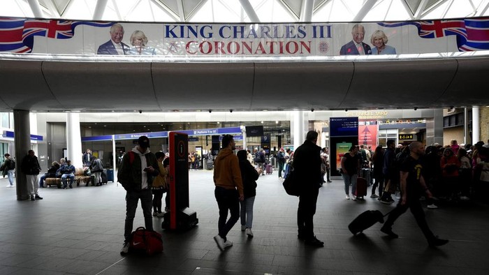 A banner celebrating the coronation of Britain's King Charles III is displayed at Kings Cross Station in London, Monday, May 1, 2023. The coronation of King Charles III will takes place at Westminster Abbey on May 6. (AP Photo/Kirsty Wigglesworth)