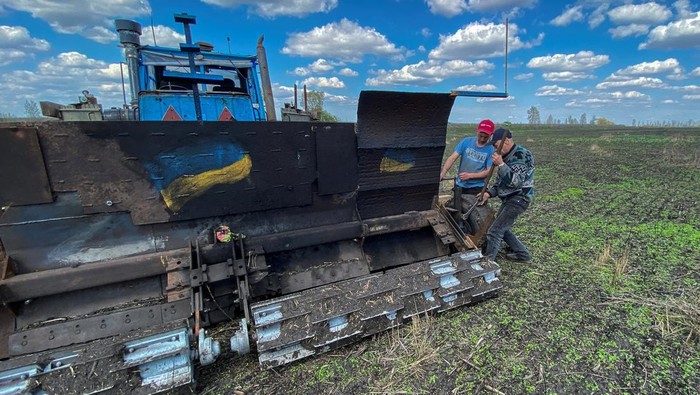 A remote controlled demining machine, created by local farmer Oleksandr Kryvtsov with his tractor and armoured plates from destroyed Russian military vehicles, is seen during demining of an agricultural field, amid Russia's attack on Ukraine, near the village of Hrakove, in Kharkiv region, Ukraine April 26, 2023. REUTERS/Vitalii Hnidyi