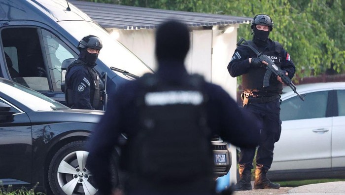 Security personnel operate, in the aftermath of a shooting, in Dubona, Serbia, May 5, 2023. REUTERS/Antonio Bronic