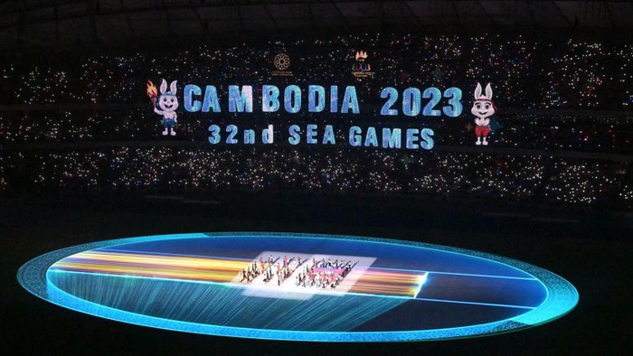 TOPSHOT - The national flag of Cambodia is brought into the Morodok Techo National Stadium at the start of the opening ceremony of the 32nd Southeast Asian Games (SEA Games) in Phnom Penh on May 5, 2023. (Photo by MOHD RASFAN / AFP) (Photo by MOHD RASFAN/AFP via Getty Images)