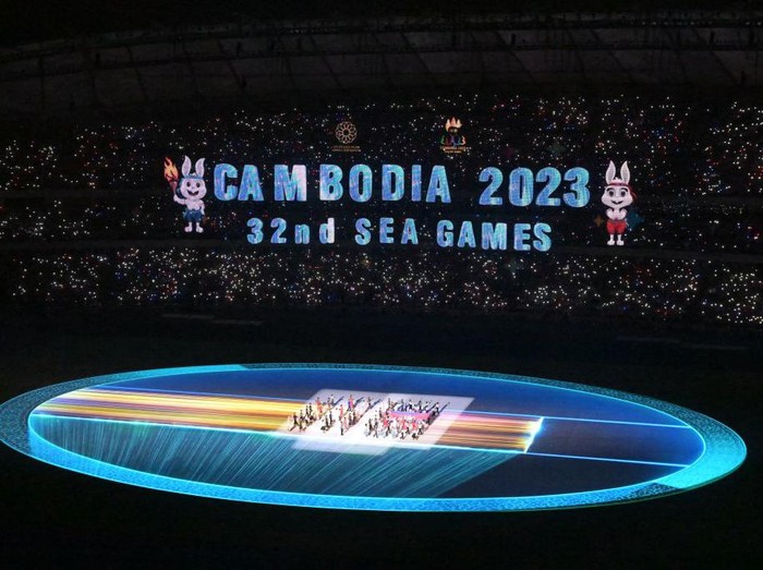 TOPSHOT - The national flag of Cambodia is brought into the Morodok Techo National Stadium at the start of the opening ceremony of the 32nd Southeast Asian Games (SEA Games) in Phnom Penh on May 5, 2023. (Photo by MOHD RASFAN / AFP) (Photo by MOHD RASFAN/AFP via Getty Images)
