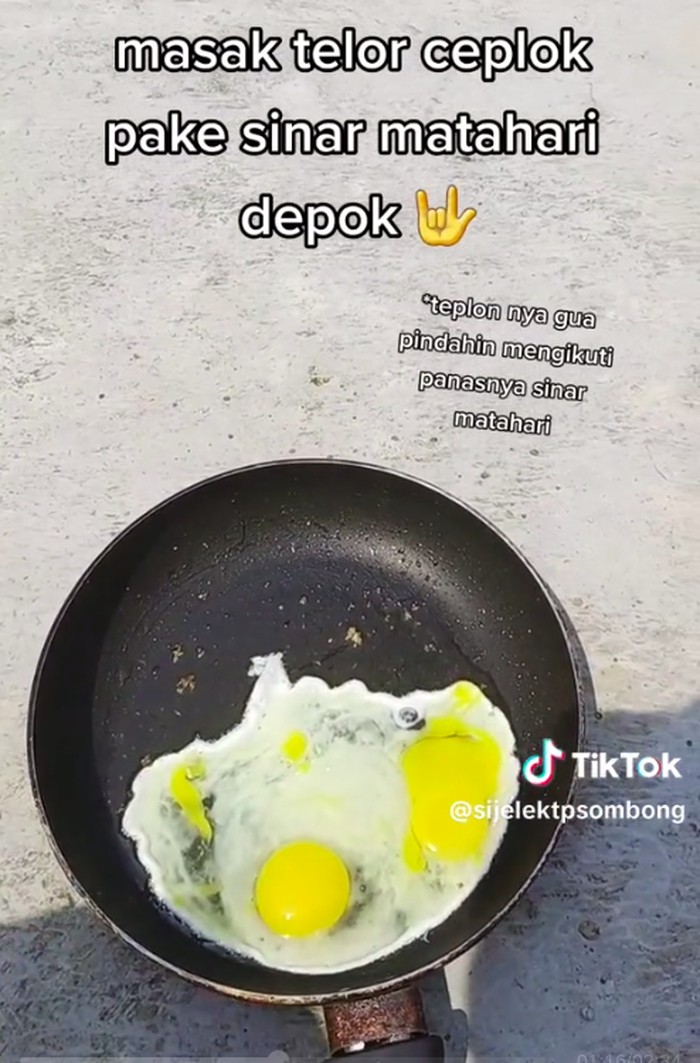 Video seorang pria di Depok menggoreng telur ceplok tanpa kompor viral di medsos. Pria itu menggoreng telur memanfaatkan panasnya cuaca. Begini ceritanya. (TikTok @sijelektpsombong)