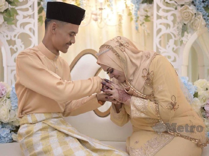 Pasangan Muhammad Danial Ahmad Ali dan Jamilah.