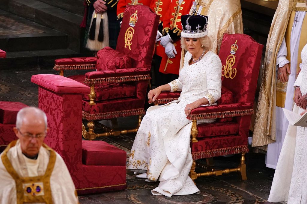 LONDON, ENGLAND - MAY 06: Queen Camilla is crowned with Queen Mary's Crown by The Archbishop of Canterbury the Most Reverend Justin Welby during the Coronation of King Charles III and Queen Camilla on May 6, 2023 in London, England. The Coronation of Charles III and his wife, Camilla, as King and Queen of the United Kingdom of Great Britain and Northern Ireland, and the other Commonwealth realms takes place at Westminster Abbey today. Charles acceded to the throne on 8 September 2022, upon the death of his mother, Elizabeth II. (Photo by Yui Mok - WPA Pool/Getty Images)