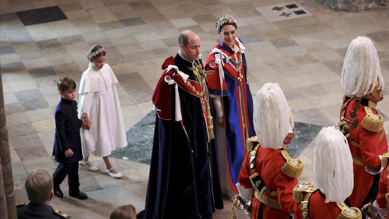 Britain's Prince William and Kate, Princess of Wales, followed by Princess Charlotte and Prince Louis, arrive at the coronation of King Charles III at Westminster Abbey, London, Saturday, May 6, 2023. (Phil Noble/Pool Photo via AP)