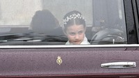LONDON, ENGLAND - MAY 06: Princess Charlotte of Wales travelling in the state car during the Coronation of King Charles III and Queen Camilla on May 06, 2023 in London, England. The Coronation of Charles III and his wife, Camilla, as King and Queen of the United Kingdom of Great Britain and Northern Ireland, and the other Commonwealth realms takes place at Westminster Abbey today. Charles acceded to the throne on 8 September 2022, upon the death of his mother, Elizabeth II. (Photo by Stuart C. Wilson/Getty Images)
