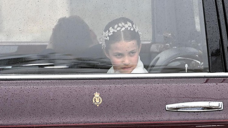 LONDON, ENGLAND - MAY 06: Princess Charlotte of Wales travelling in the state car during the Coronation of King Charles III and Queen Camilla on May 06, 2023 in London, England. The Coronation of Charles III and his wife, Camilla, as King and Queen of the United Kingdom of Great Britain and Northern Ireland, and the other Commonwealth realms takes place at Westminster Abbey today. Charles acceded to the throne on 8 September 2022, upon the death of his mother, Elizabeth II. (Photo by Stuart C. Wilson/Getty Images)