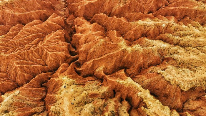ULANQAB, CHINA - MAY 01: Aerial view of Dahong Mountain after thousands of years of wind and rain erosion on May 1, 2023 in Ulanqab, Inner Mongolia Autonomous Region of China. (Photo by VCG/VCG via Getty Images)