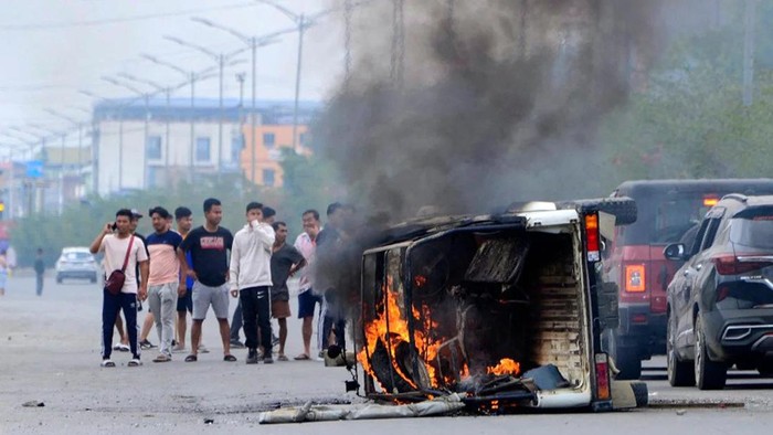 Smoke billows from a vehicle burned during an outbreak of ethnic violence in Imphal, the capital of Indias Manipur state, on May 4. (Stringer/AFP/Getty Images)