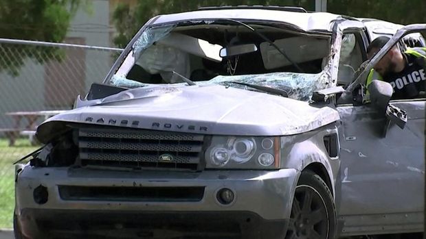 A law enforcement officer investigates a damaged vehicle after it ran into pedestrians near Ozanam Center, a shelter for migrants and homeless, in Brownsville, Texas, U.S. May 7, 2023 in a still image from video. ABC affiliate KRGV via REUTERS    NO RESALES. NO ARCHIVES.  MANDATORY CREDIT