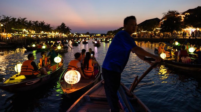 Tourists ride boats along the Thu Bon River in the old town of Hoi An, Qung Nam Province, Vietnam, on Thursday, May 4, 2023. Vietnam's retail sales grew 11.5% in April, according to figures released by the General Statistics Office of Vietnam. Photographer: SeongJoon Cho/Bloomberg via Getty Images
