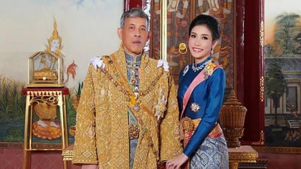 FILE - This undated file photo posted on Aug. 26, 2019, on the Thailand Royal Office website shows King Maha Vajiralongkorn, left, with Major General Sineenatra Wongvajirabhakdi, the royal noble consort. Thailand's king has reconciled with his royal consort, whom he stripped of her titles last year after accusing her of seeking to undermine his official wife, the country's queen. (Thailand Royal Office via AP, File)