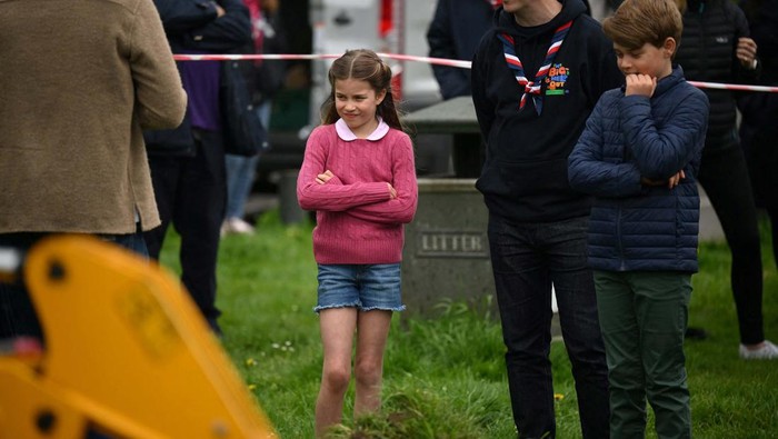 Britain's Princess Charlotte of Wales and Britain's Prince George of Wales look on as they join their parents taking part in the Big Help Out, during a visit to the 3rd Upton Scouts Hut in Slough, west of London, Britain, May 8, 2023. Daniel Leal/Pool via REUTERS