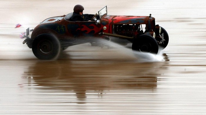 Motoring enthusiasts take part in the 'Race The Waves' classic car and motorcycle meet at the beach in Bridlington, Britain, April 22, 2023. REUTERS/Lee Smith