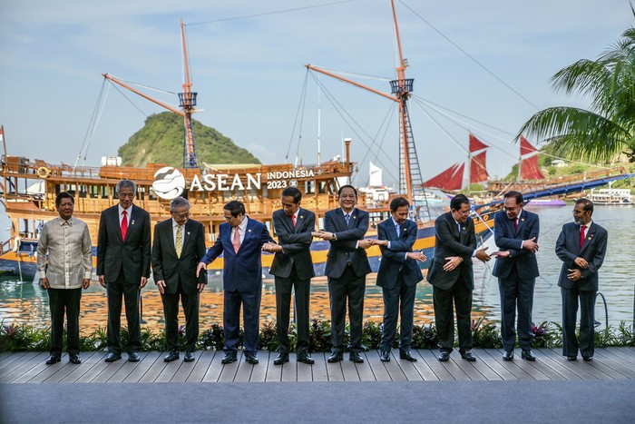 From left to right, Philippines President Ferdinand Marcos, Jr., Singapores Prime Minister Lee Hsien Loong, Thailands Deputy Prime Minister and Foreign Minister Don Pramudwinai, Vietnams Prime Minister Pham Minh Chinh, Indonesian President Joko Widodo, Laotian Prime Minister Sonexay Siphandone, Bruneis Sultan Hassanal Bolkiah, Cambodias Prime Minister Hun Sen, Malaysian Prime Minister Anwar Ibrahim and East Timorese Prime Minister Taur Matan Ruak share a light moment during the group photo session at the 42nd ASEAN Summit in Labuan Bajo, East Nusa Tenggara, Indonesia, Wednesday, May 10, 2023. (Bay Ismoyo/Pool Photo via AP)