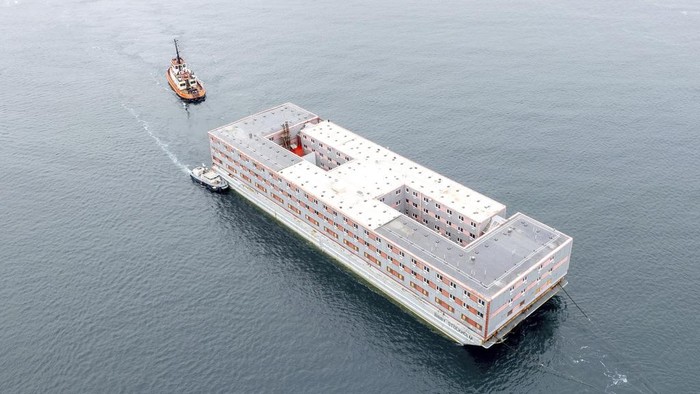 The Bibby Stockholm accommodation barge arrives into Falmouth, Cornwall, England, to undergo inspection Tuesday May 9, 2023. The 222-bedroom, three-storey vessel, will house around 500 migrants when it is in position in Portland Port. (Matt Keeble/PA via AP)