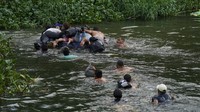 Para migran ini berasal dari negara-negara konflik. Mereka berjalan ke AS untuk mencari perlindungan.  