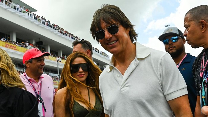 US actor Tom Cruise (R) and Colombian singer Shakira (L) attend the 2023 Miami Formula One Grand Prix at the Miami International Autodrome in Miami Gardens, Florida, on May 7, 2023. (Photo by CHANDAN KHANNA / AFP) (Photo by CHANDAN KHANNA/AFP via Getty Images)