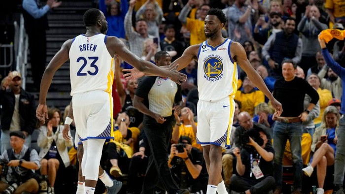 SAN FRANCISCO, CALIFORNIA - MAY 10: Draymond Green #23 and Andrew Wiggins #22 of the Golden State Warriors react to a play  during the second quarter against the Los Angeles Lakers in game five of the Western Conference Semifinal Playoffs at Chase Center on May 10, 2023 in San Francisco, California. NOTE TO USER: User expressly acknowledges and agrees that, by downloading and or using this photograph, User is consenting to the terms and conditions of the Getty Images License Agreement. (Photo by Thearon W. Henderson/Getty Images)