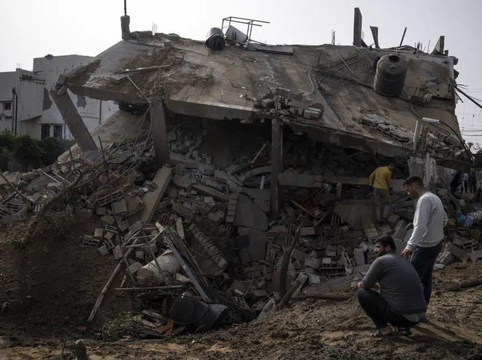 Palestinians inspect the rubble of a house after it was struck by an Israeli airstrike in Deir al-Balah, central Gaza Strip, Friday, May 12, 2023. (AP Photo/Fatima Shbair)