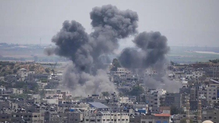 Smoke rises from an explosion caused by an Israeli airstrike, in Gaza Strip, Friday, May 12, 2023. (AP Photo/Hatem Moussa)