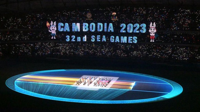 TOPSHOT - The national flag of Cambodia is brought into the Morodok Techo National Stadium at the start of the opening ceremony of the 32nd Southeast Asian Games (SEA Games) in Phnom Penh on May 5, 2023. (Photo by MOHD RASFAN / AFP) (Photo by MOHD RASFAN/AFP via Getty Images)