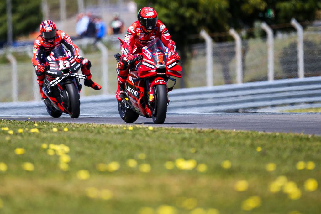 LAGOA, ALGARVE, PORTUGAL - MARCH 26: Francesco Bagnaia (Ducati Lenovo Team) and Maverick Vinales (Aprilia Racing) in action during the MotoGP Of Portugal - Race at Autodromo do Algarve on March 26, 2023 in Lagoa, Algarve, Portugal. (Photo by Diogo Cardoso/DeFodi Images via Getty Images)