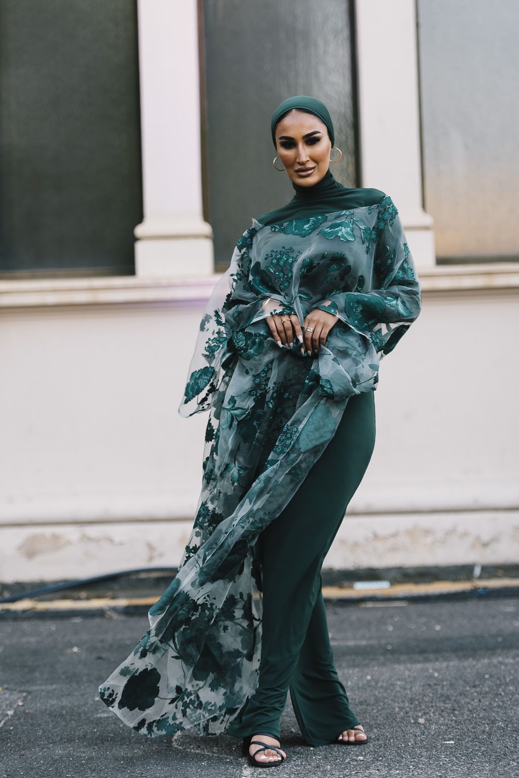 PARIS, FRANCE - APRIL 21: Alba Garavito Torre wears a baby blue and white striped print pattern puffy short sleeves / long dress from The Label Edition, gold bracelets, gold rings, a pale pink matte leather Capazo handbag from Saonara, during a street style fashion photo session, on April 21, 2023 in Paris, France. (Photo by Edward Berthelot/Getty Images)
