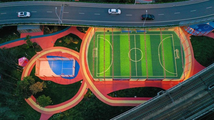 NANJING, CHINA - MARCH 18, 2023 - People play on a trial court at the 24-hour City Sports Block in Nanjing, East China's Jiangsu province, March 18, 2023. At present, some sports venues such as football and basketball courts have begun trial operation. There are sports areas such as sports square, roller skating area, archery archway, badminton court, net celebrity basketball court and football field in the block, which are connected together to form an open sports space of 