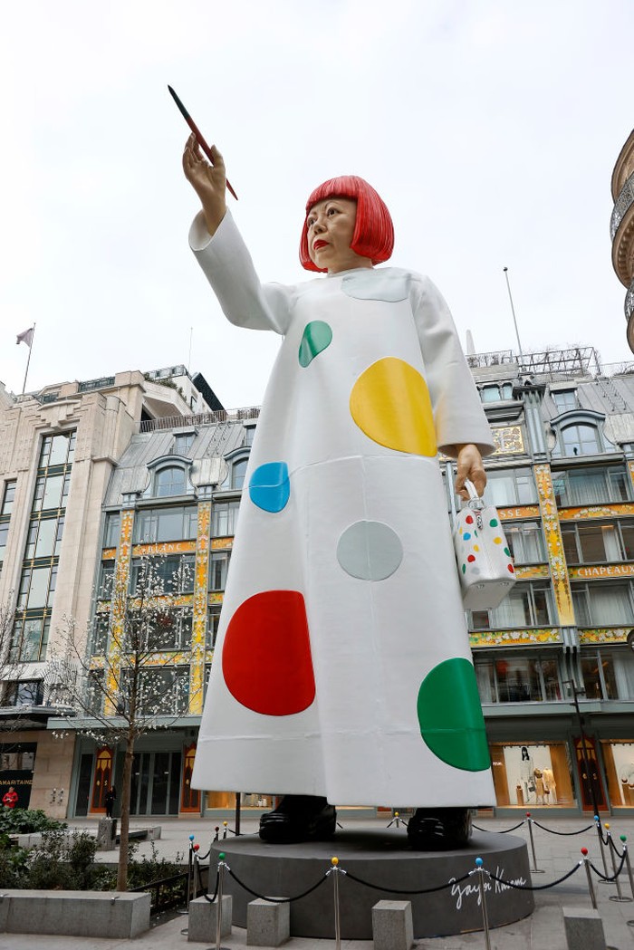 PARIS, FRANCE - MARCH 06: A huge sculpture in the likeness of Yayoi Kusama is erected between the headquarters of the Maison Louis Vuitton and the Samaritaine department store on March 06, 2023 in Paris, France. A free, masterful and surprising installation in honor of Louis Vuitton's new collaboration with the famous designer. Yayoi Kusama is an avant-garde Japanese contemporary artist, painter, sculptor and writer who often uses polka dots and colors in her works. (Photo by Chesnot/Getty Images)
