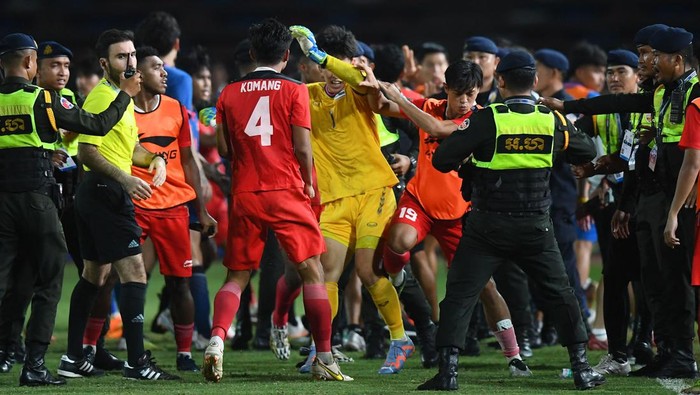Security officials gather after a fight breaks out on the sidelines of the mens football final match between Indonesia and Thailand during the 32nd Southeast Asian Games (SEA Games) in Phnom Penh on May 16, 2023. (Photo by Nhac NGUYEN / AFP) (Photo by NHAC NGUYEN/AFP via Getty Images)