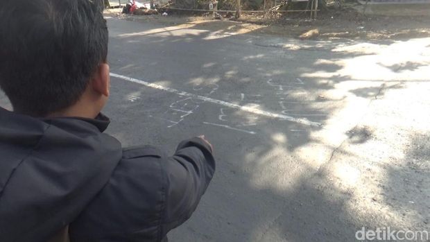 Jalan yang jadi korban vandalisme.