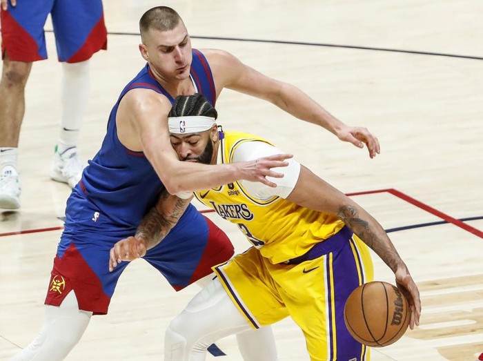DENVER, CO - MAY 16: Los Angeles Lakers forward Anthony Davis, right, is defended by Denver Nuggets center Nikola Jokic during the first half of game one in the NBA Playoffs Western Conference Finals at Ball Arena on Tuesday, May 16, 2023 in Denver, CO. (Robert Gauthier / Los Angeles Times via Getty Images)