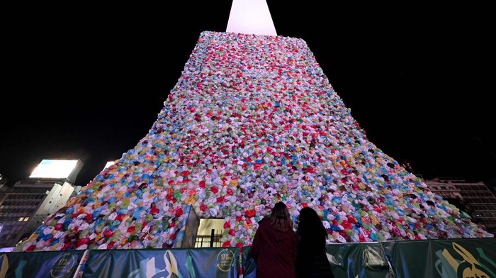 General view of the Obelisk covered with plastic bags as part of an artistic intervention on the eve of World Recycling Day in Buenos Aires, taken on May 16, 2023. (Photo by Luis ROBAYO / AFP) (Photo by LUIS ROBAYO/AFP via Getty Images)