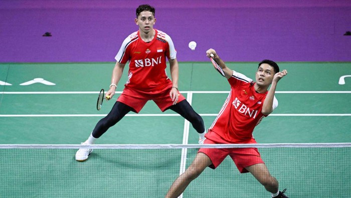 Indonesias Fajar Alfian (R) and Muhammad Rian Ardianto play a point against Thailands Supak Jomkoh and Kittinupong Kedren during their mens doubles match at the 2023 Sudirman Cup world badminton championships in Suzhou in Chinas eastern Jiangsu province on May 18, 2023. (Photo by WANG Zhao / AFP) (Photo by WANG ZHAO/AFP via Getty Images)