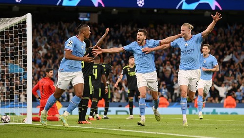 MANCHESTER, ENGLAND - MAY 17: Manuel Akanji celebrates with Erling Haaland of Manchester City after an own goal by Eder Militao of Real Madrid (not pictured) Manchester Citys third goal during the UEFA Champions League semi-final second leg match between Manchester City FC and Real Madrid at Etihad Stadium on May 17, 2023 in Manchester, England. (Photo by Michael Regan/Getty Images)