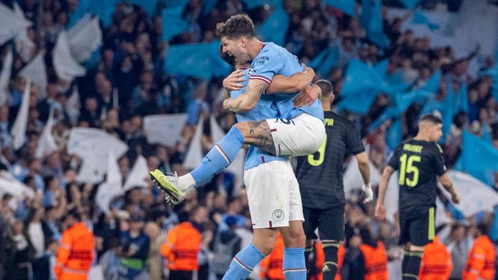 MANCHESTER, ENGLAND - MAY 17: Manuel Akanji celebrates with Erling Haaland of Manchester City after scoring the teams third goal during the UEFA Champions League semi-final second leg match between Manchester City FC and Real Madrid at Etihad Stadium on May 17, 2023 in Manchester, England. (Photo by Michael Regan/Getty Images)