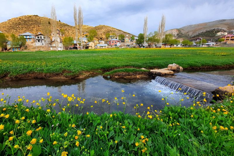 ANTALYA, TURKIYE - MAY 11: A person rides a bike among the blooming flowers in the Egrigol region with an altitude of 2350, which has a very valuable structure due to its endemic plant and flower species at Taseli plateau in Antalya, Turkiye on May 11, 2023. The foot of Geyik Mountain, located between the Western Taurus Mountains and the Central Taurus Mountains, which separate the Central Anatolia and the Mediterranean region from each other, are referred to as the Alps of Antalya. (Photo by Seyit Konyali/Anadolu Agency via Getty Images)