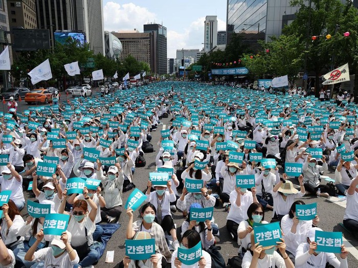 Nurses and university students majoring in nursing hold up signs that read Nurse act, during a protest against President Yoon Suk Yeol vetoing a nursing act that defines the roles and responsibilities of nurses, in Seoul, South Korea, May 19, 2023. REUTERS/Kim Hong-Ji