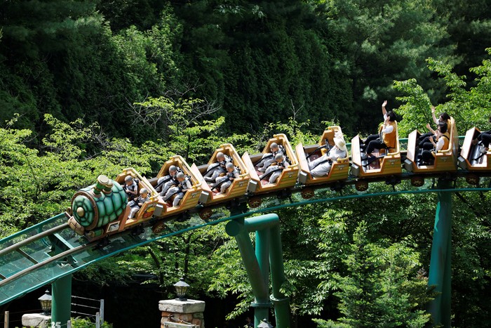 Boys who are experiencing the lives of Buddhist monks by staying in a temple for three weeks as novice monks, enjoy a ride at Everland amusement park in Yongin, South Korea, May 17, 2023.  REUTERS/Kim Soo-hyeon     TPX IMAGES OF THE DAY
