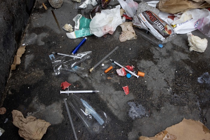 NEW YORK, NEW YORK - SEPTEMBER 22: Used needles are seen on the street during a city sweep of a homeless encampment, September 22, 2022 in New York City, New York. (Photo by Andrew Lichtenstein/Corbis via Getty Images)