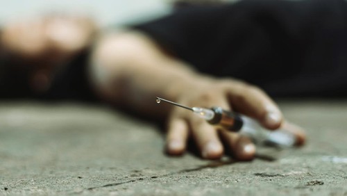 Man desperate and alone in the dark