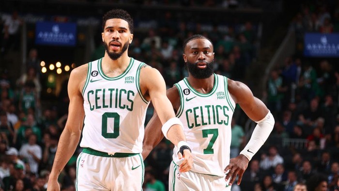BOSTON, MA - MAY 19: Jayson Tatum #0 and Jaylen Brown #7 of the Boston Celtics look on during Game Two of the Eastern Conference Finals against the Miami Heat on May 19, 2023 at the TD Garden in Boston, Massachusetts. NOTE TO USER: User expressly acknowledges and agrees that, by downloading and or using this photograph, User is consenting to the terms and conditions of the Getty Images License Agreement. Mandatory Copyright Notice: Copyright 2023 NBAE  (Photo by Nathaniel S. Butler/NBAE via Getty Images)