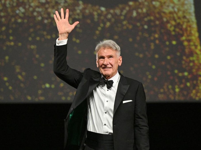 Harrison Ford CANNES, FRANCE - MAY 18: Harrison Ford receives an honorary Palme DOr from Iris Knobloch during the 76th annual Cannes film festival at Palais des Festivals on May 18, 2023 in Cannes, France. (Photo by Stephane Cardinale - Corbis/Corbis via Getty Images)